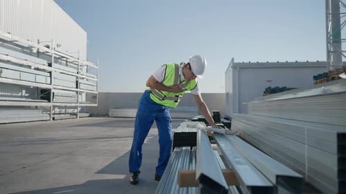 Ill Middle Eastern Man in Hard Hat Holding Chest Having Symptoms of Heart Attack Stroke As Caucasian