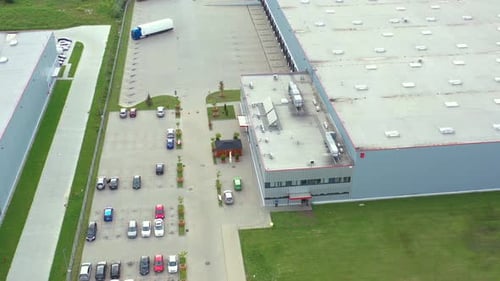 Logistics park with warehouses, loading hub and a lot of semi-trailer trucks waits for load and unlo