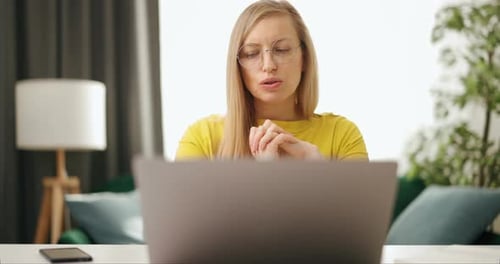 Woman Talking at Laptop During Video Conference