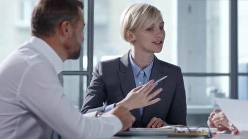 Four Adults in a Business Meeting