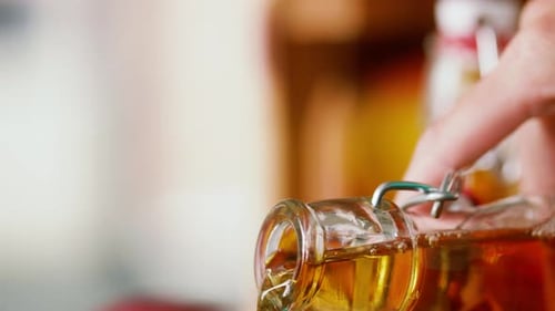 Apple Juice Being Poured From Bottle Into Glass