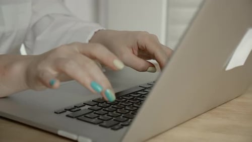 Close Up Of Woman Typing on Laptop Keyboard