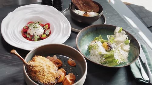 Set Table with Gourmet High Kitchen Dinner Plates and Dishes at the Restaurant