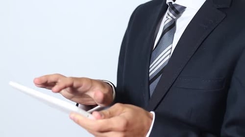 Business Person Using Tablet Device in Corporate Setting