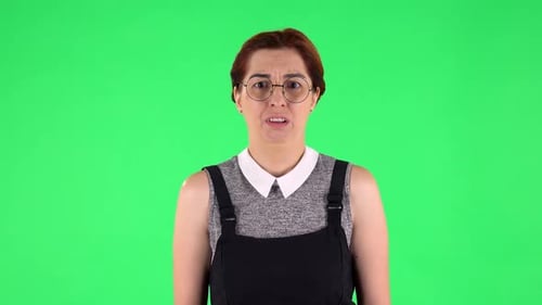 Portrait of Funny Girl in Round Glasses Frustrated Saying Wow. Green Screen