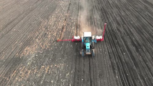 Tractor Plowing Field Preparing Soil for Planting
