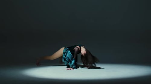 Charming Brunette Dancing Modern Contemporary Choreography on Gray Studio Background