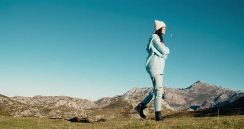 Traveler Young Adult Woman Walk on Mountain with Summit View