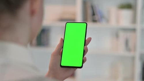 Rear View of Woman Using Smartphone with Chroma Key Screen