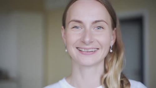 Smiling Young Woman Wearing Dental Braces