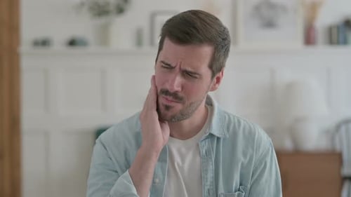 Portrait of Sick Young Man Having Toothache Pain