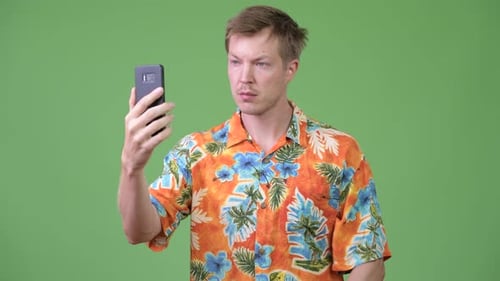Young Handsome Tourist Man Using Phone