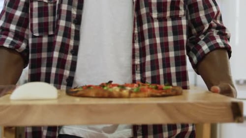 Man making pizza at home