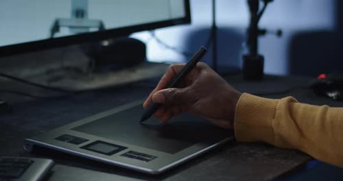 Hand Using Digital Drawing Tablet with Pen