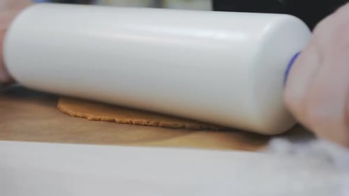 Preparing Dough for Dessert on a Wooden Surface