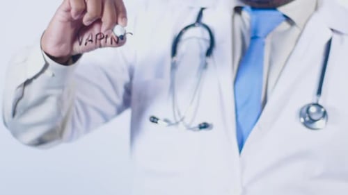 Doctor Writes The Word Vaping On Clear Surface