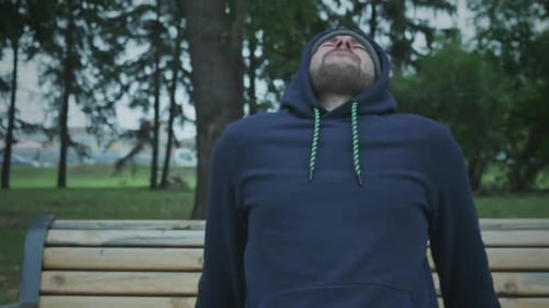 Man Exercising in Park Doing Tricep Dips