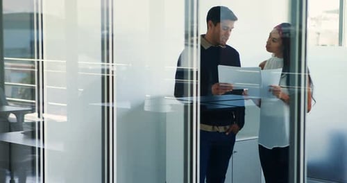 Colleagues Discussing Tablet in Modern Office