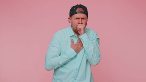 Man Coughing Holding Chest in Painful Illness