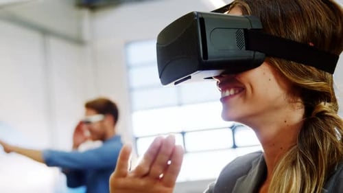 Woman Experiences Virtual Reality in Modern Office Setting