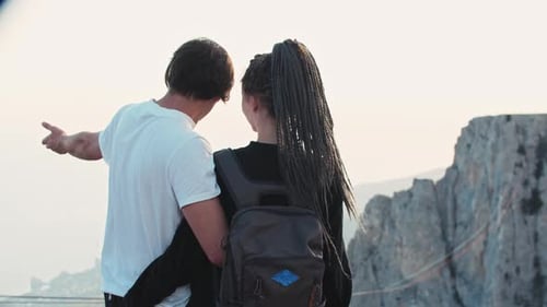 Young Couple Enjoying Mountain Vista Together