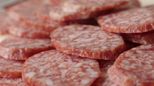 Tasty cured sausage of air-dried meat cuts slow pan 4K 2160p 30fps UltraHD footage - Dry salami sm