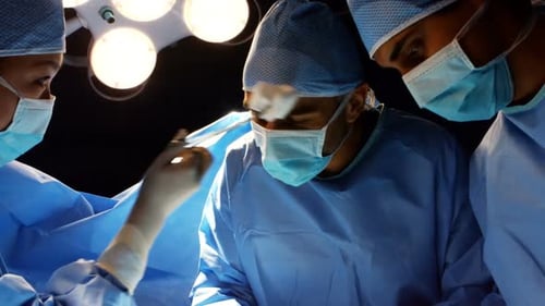Surgeons Performing Medical Procedure in Operating Room
