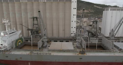 Aeial View. Loading of Grain on a Ship. Port. Cargo Ship.