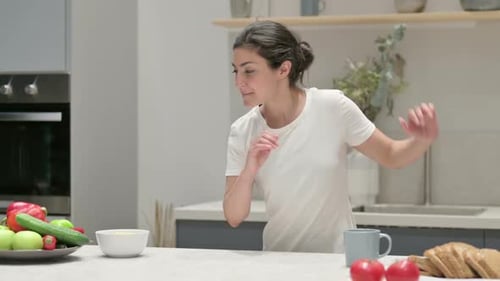 Woman Dancing in Kitchen