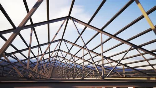 Armazón de techo de acero con forma de bucle sobre un fondo de cielo nublado. Edificio de construcción