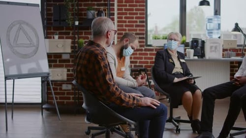 Adults in a Circle at a Therapy Session