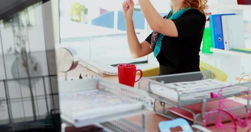 Woman Using VR Headset in Bright Modern Office