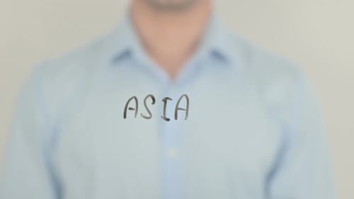 Hand Writing ASIA on Transparent Surface