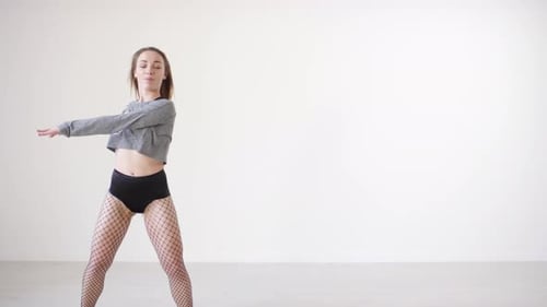 Young Sensual Woman Dancing in Studio