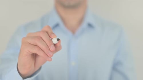 Man Writes Action on a Clear Screen