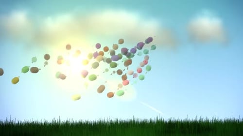 Blue sky with the clouds and the green grass waving on the wind blows.