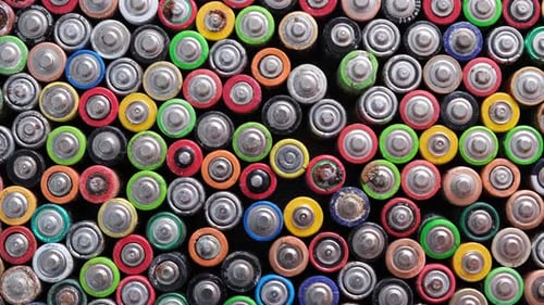 Pile of used batteries