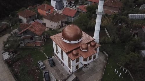 Aerial Shot Of A Mosque In A Mountain Village
