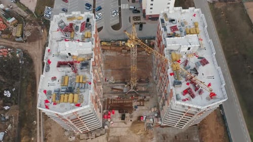 Aerial View of the Construction Site of Two Residential Buildings in the Middle of the Day