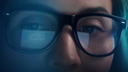 Close Up of Tired Woman Working at Night on Laptop Girl in Eye Glasses with Reflections Overworking