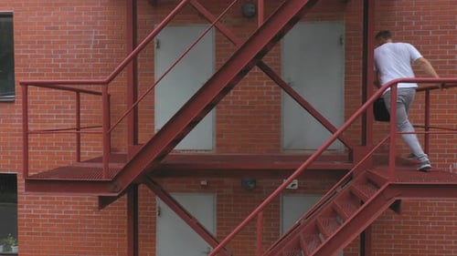 Hurry Young Businessman Running Up on Stair Going to Office