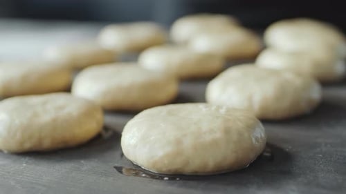 Sprinkling Sesame Seeds on Top of Bun