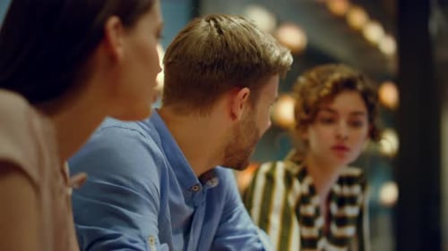 Young People Conferring in Office