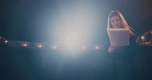 Actors Rehearsing Lines on a Moody Stage