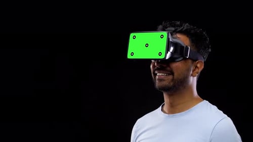 Man Using VR Headset with Chroma Key Screen