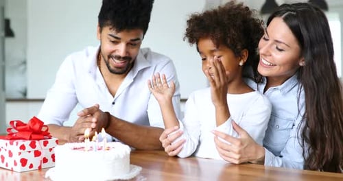 Happy Family Celebrating Birthday with Cake and Gift