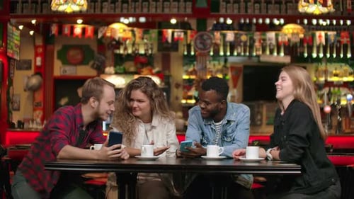 Friends Together in a Pub Using Smartphones