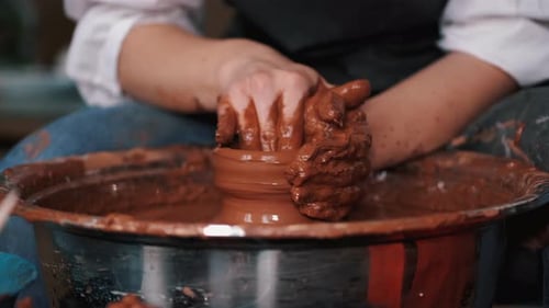 Artist Shaping Clay on Pottery Wheel Close Up