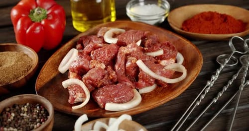 Marinated Raw Pork Kebab with Onions Slowly Rotates.