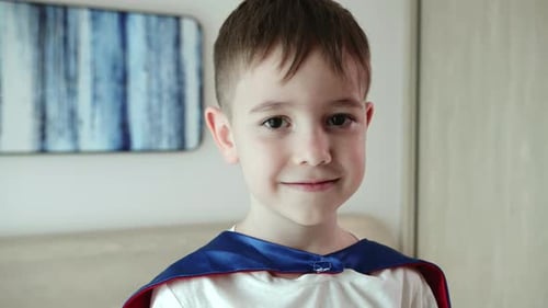 Boy Wearing Cape Smiling Close Up Portrait